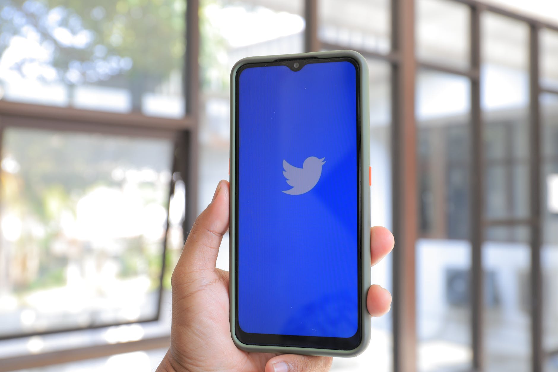 twitter logo on smartphone screen