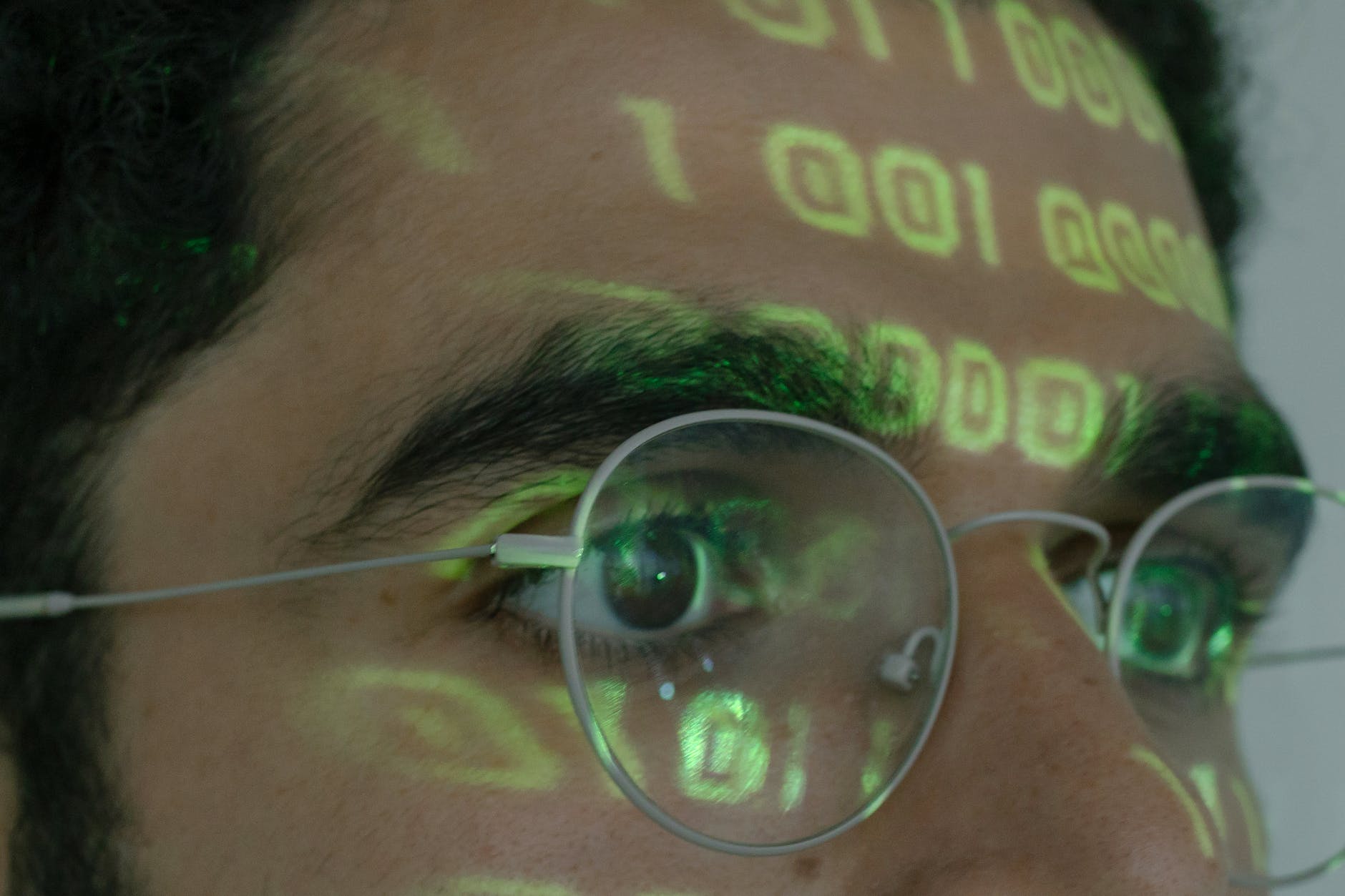 person wearing silver framed eyeglasses