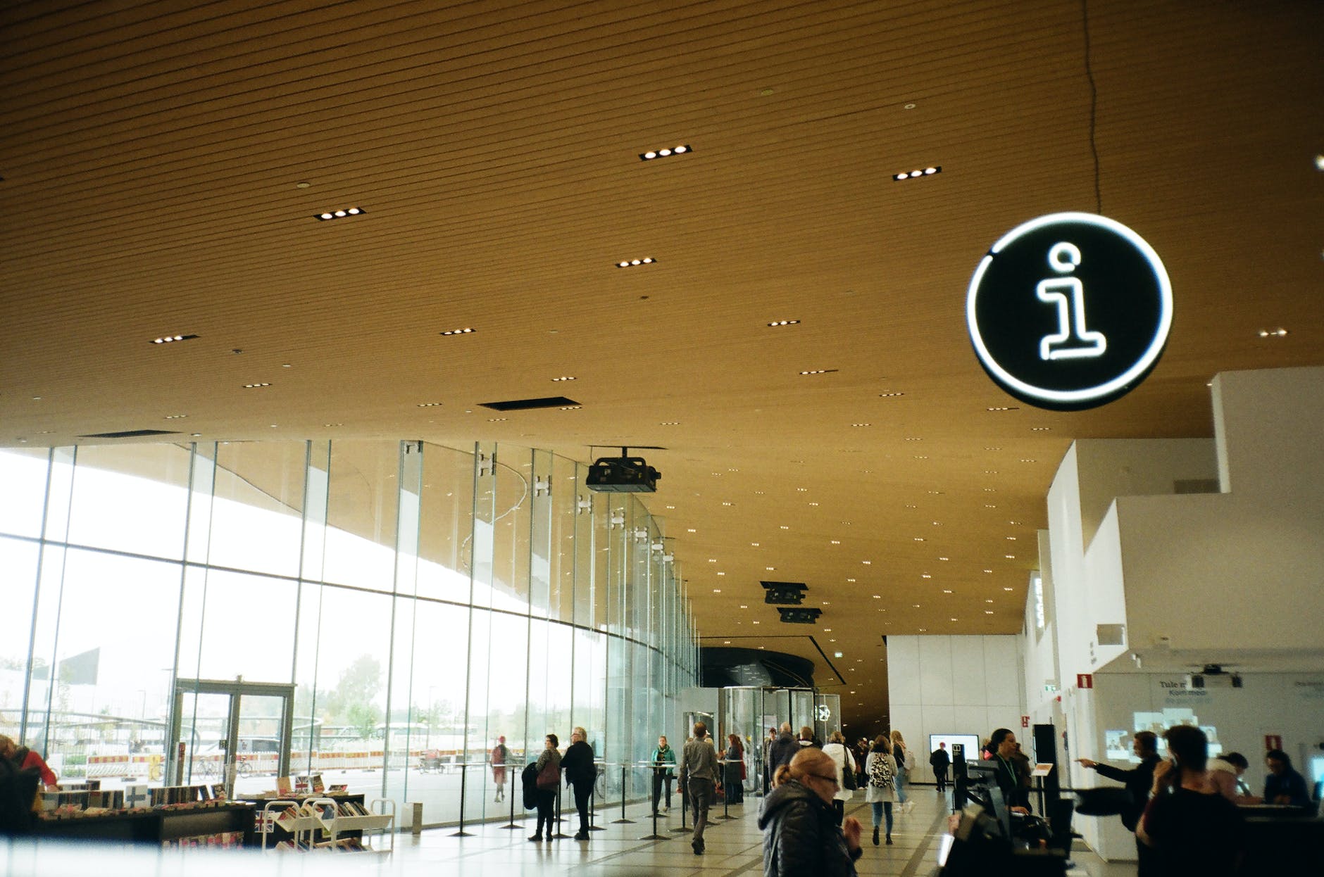 people walking inside well lit building